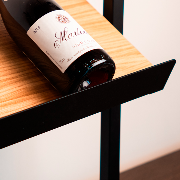 black iron shelf edge for a classic oak shelf to display bottles of wine 